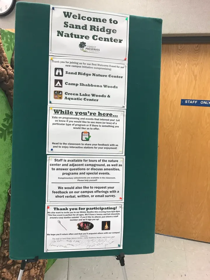 A welcome sign by the nature center door.