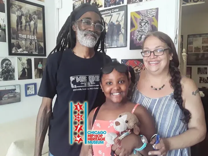 A family posing together in the museum.